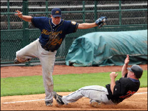 Matt Dumont of the Boston Mariners tries for tag