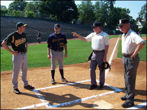 Skippers Kevin McGowan and Matt Englander take ground rules at Doubleday Field