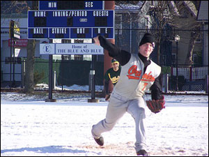 US Army's Kevin Bell pitches through the snow