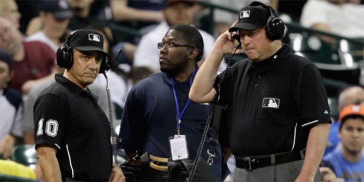 Umpires Using Instant Replay at Baseball Game