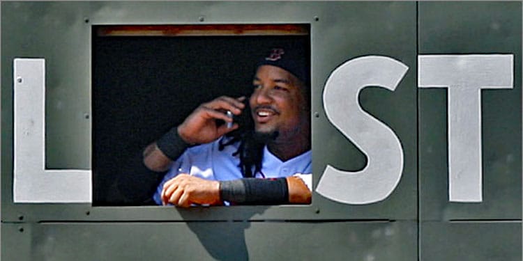 Manny Making a Phone Call in the Green Monster During Pitching Change