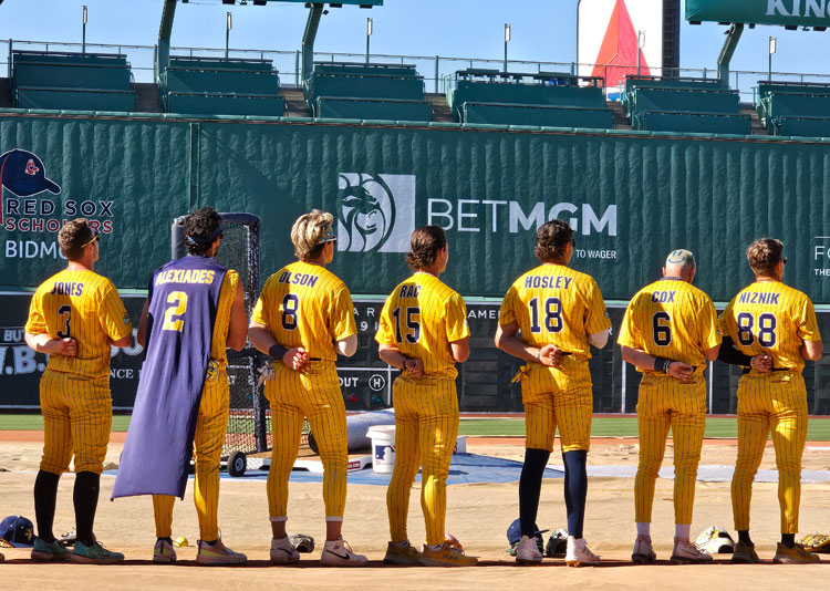 The Savannah Bananas Rise for National Anthem at Fenway Park