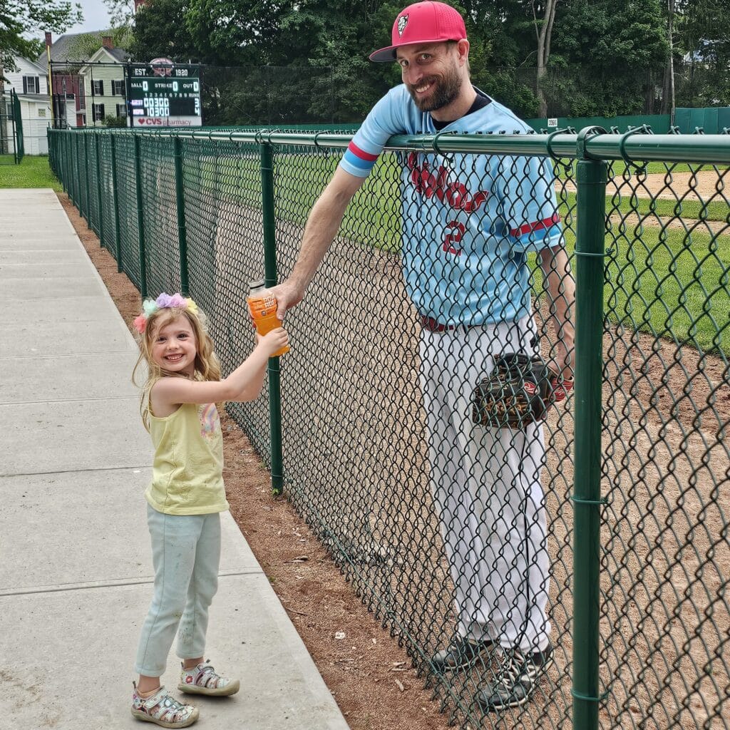 Brad Presler of the Niagara Devils with His Daughter at Doubleday